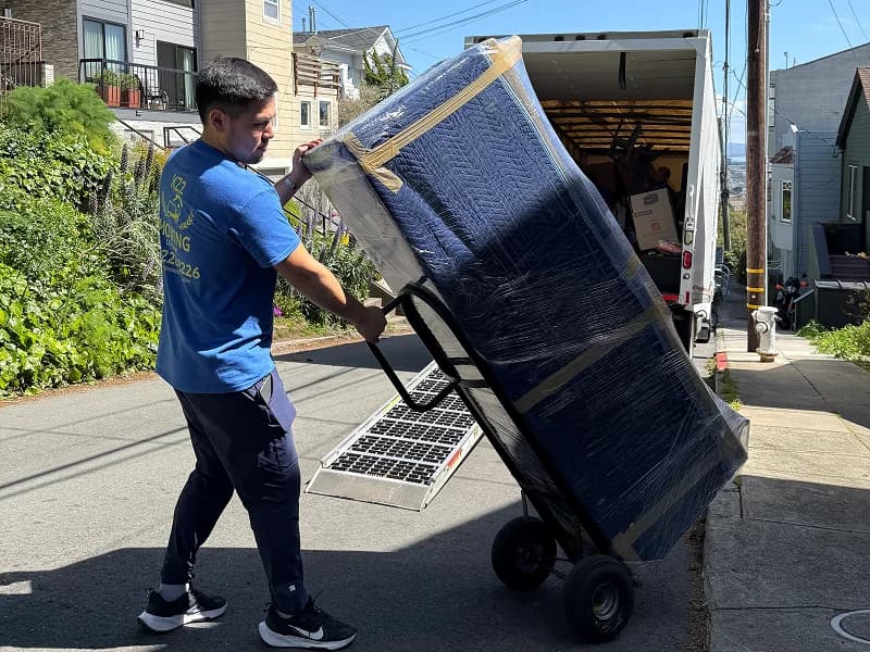 professional movers loading a truck
