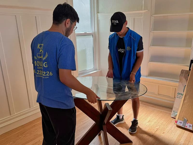 How to prevent common moving risks Professional movers safely loading furniture into a truck in San Francisco